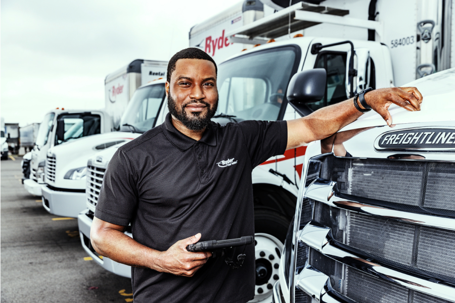 dedicated transportation driver inspecting truck